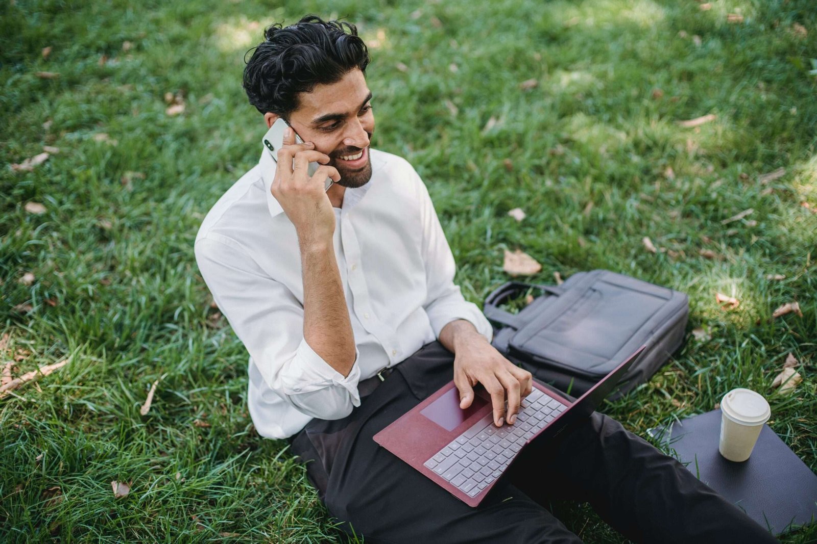 Photo by Ketut Subiyanto: https://www.pexels.com/photo/a-businessman-sitting-on-grass-while-having-a-phone-call-4962986/