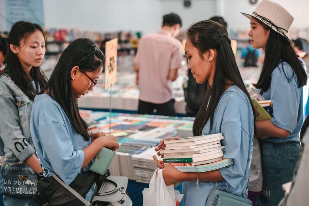 Photo by Streetwindy: https://www.pexels.com/photo/girls-buying-books-4058668/